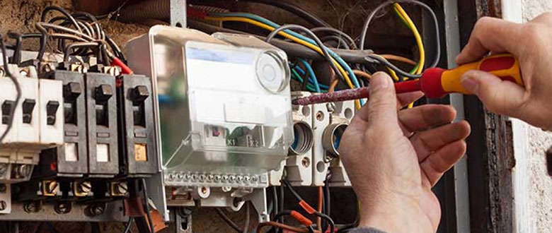 an electrician working on an electrical panel upgrade